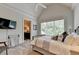 Comfortable bedroom with a large window and ensuite bathroom access at 962 Chattooga Trce, Suwanee, GA 30024