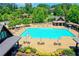 Lap pool and leisure pool with surrounding lounge area at 962 Chattooga Trce, Suwanee, GA 30024