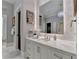 Elegant bathroom with marble vanity, large mirror, and frameless shower at 962 Chattooga Trce, Suwanee, GA 30024