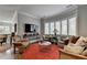 Relaxing sitting room with bay window and comfortable seating at 962 Chattooga Trce, Suwanee, GA 30024