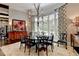 Elegant dining room with a round table, chandelier, and large windows offering natural light at 962 Chattooga Trce, Suwanee, GA 30024