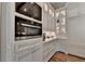 Built-in appliances and white shaker cabinets highlight this kitchen at 962 Chattooga Trce, Suwanee, GA 30024