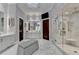 Spa-like bathroom with marble flooring, large shower, and double vanity at 962 Chattooga Trce, Suwanee, GA 30024