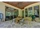 Covered patio with dining area and green egg grill at 962 Chattooga Trce, Suwanee, GA 30024