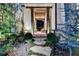 Charming entryway with stone columns and lush landscaping at 962 Chattooga Trce, Suwanee, GA 30024