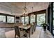 Large screened porch with dining and seating areas at 962 Chattooga Trce, Suwanee, GA 30024