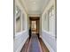 Bright hallway with hardwood floors and windows allowing natural light at 962 Chattooga Trce, Suwanee, GA 30024