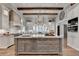 Large kitchen island with marble countertops and custom cabinetry at 962 Chattooga Trce, Suwanee, GA 30024