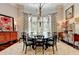 Formal dining room with a round table and bay window at 962 Chattooga Trce, Suwanee, GA 30024