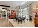 Elegant dining room featuring a large table, chandelier, and hardwood floors at 962 Chattooga Trce, Suwanee, GA 30024