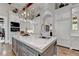 Spacious kitchen with marble countertops, island, and stainless steel appliances at 962 Chattooga Trce, Suwanee, GA 30024
