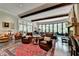 Spacious living room with exposed beams, fireplace and comfortable seating at 962 Chattooga Trce, Suwanee, GA 30024