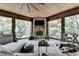 Cozy screened porch with stone fireplace and comfortable seating at 962 Chattooga Trce, Suwanee, GA 30024