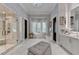 Spa-like Primary bath with a walk-in shower, freestanding tub, and marble finishes at 962 Chattooga Trce, Suwanee, GA 30024