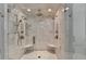 Luxurious double shower with marble surround and multiple shower heads at 962 Chattooga Trce, Suwanee, GA 30024