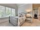 Bright bedroom with a metal bed frame and ample natural light at 962 Chattooga Trce, Suwanee, GA 30024