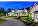 Curving driveway leading to a luxurious home entrance at 962 Chattooga Trce, Suwanee, GA 30024