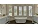 Spa-like bathroom with large soaking tub and bay window at 962 Chattooga Trce, Suwanee, GA 30024