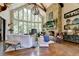 Spacious living room features a stone fireplace, hardwood floors, and abundant natural light at 962 Chattooga Trce, Suwanee, GA 30024