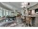 Basement game room with a pool table and a stylish bar at 962 Chattooga Trce, Suwanee, GA 30024