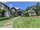 Stunning home exterior with landscaped lawn and stone walkway at 962 Chattooga Trce, Suwanee, GA 30024