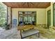 Stone patio with dining table and seating, perfect for outdoor meals at 962 Chattooga Trce, Suwanee, GA 30024