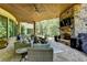 Relaxing covered patio with fireplace and comfortable seating at 962 Chattooga Trce, Suwanee, GA 30024