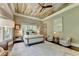 Luxurious main bedroom with a ceiling fan and plenty of natural light at 962 Chattooga Trce, Suwanee, GA 30024