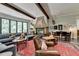 Spacious game room with a fireplace, comfortable seating, and a dining table at 962 Chattooga Trce, Suwanee, GA 30024