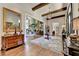 Elegant entryway with hardwood floors, antique furniture, and view to Gathering room at 962 Chattooga Trce, Suwanee, GA 30024