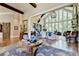 Spacious entryway with hardwood floors, unique art, and view to living room at 962 Chattooga Trce, Suwanee, GA 30024