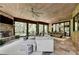 Relaxing screened porch with comfortable seating, fireplace and dining area at 962 Chattooga Trce, Suwanee, GA 30024