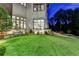 Luxury home with stone accents and manicured landscaping at dusk at 962 Chattooga Trce, Suwanee, GA 30024