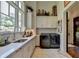Laundry room with quartz countertops, sink, and large window at 962 Chattooga Trce, Suwanee, GA 30024