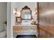 Elegant powder room with shiplap walls, floating vanity, and ornate mirror at 962 Chattooga Trce, Suwanee, GA 30024