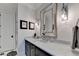 Stylish bathroom with marble vanity and updated fixtures at 962 Chattooga Trce, Suwanee, GA 30024