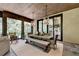 Spacious screened porch with dining area and wood ceiling at 962 Chattooga Trce, Suwanee, GA 30024