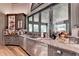 Gray cabinetry home bar with granite countertops and beverage cooler at 962 Chattooga Trce, Suwanee, GA 30024