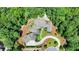 Bird's-eye view of a luxury home nestled in a wooded area at 962 Chattooga Trce, Suwanee, GA 30024
