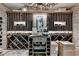 Custom wine cellar with extensive built-in racking and brick feature wall at 962 Chattooga Trce, Suwanee, GA 30024