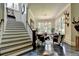 Rustic-chic living room with a stunning staircase and statement decor at 962 Chattooga Trce, Suwanee, GA 30024