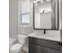 Contemporary bathroom with gray vanity, quartz countertop, and a black faucet at 1420 Coretta Bend, Atlanta, GA 30318