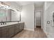 Modern bathroom with double vanity, marble shower, and walk-in closet at 1420 Coretta Bend, Atlanta, GA 30318