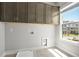 Laundry room with cabinetry and window at 1420 Coretta Bend, Atlanta, GA 30318