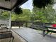Spacious deck with seating area and lush greenery at 2023 Lee Dr, Austell, GA 30168