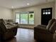 Spacious living room featuring hardwood floors and large windows at 2023 Lee Dr, Austell, GA 30168