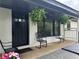 Modern front entry with black door and hanging plants at 2023 Lee Dr, Austell, GA 30168