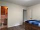 Bedroom with ensuite bathroom and wood flooring at 2023 Lee Dr, Austell, GA 30168