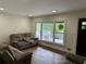 Bright living room with hardwood floors and comfy seating at 2023 Lee Dr, Austell, GA 30168