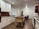 Open kitchen with a large island, white cabinets, and tile flooring at 2023 Lee Dr, Austell, GA 30168